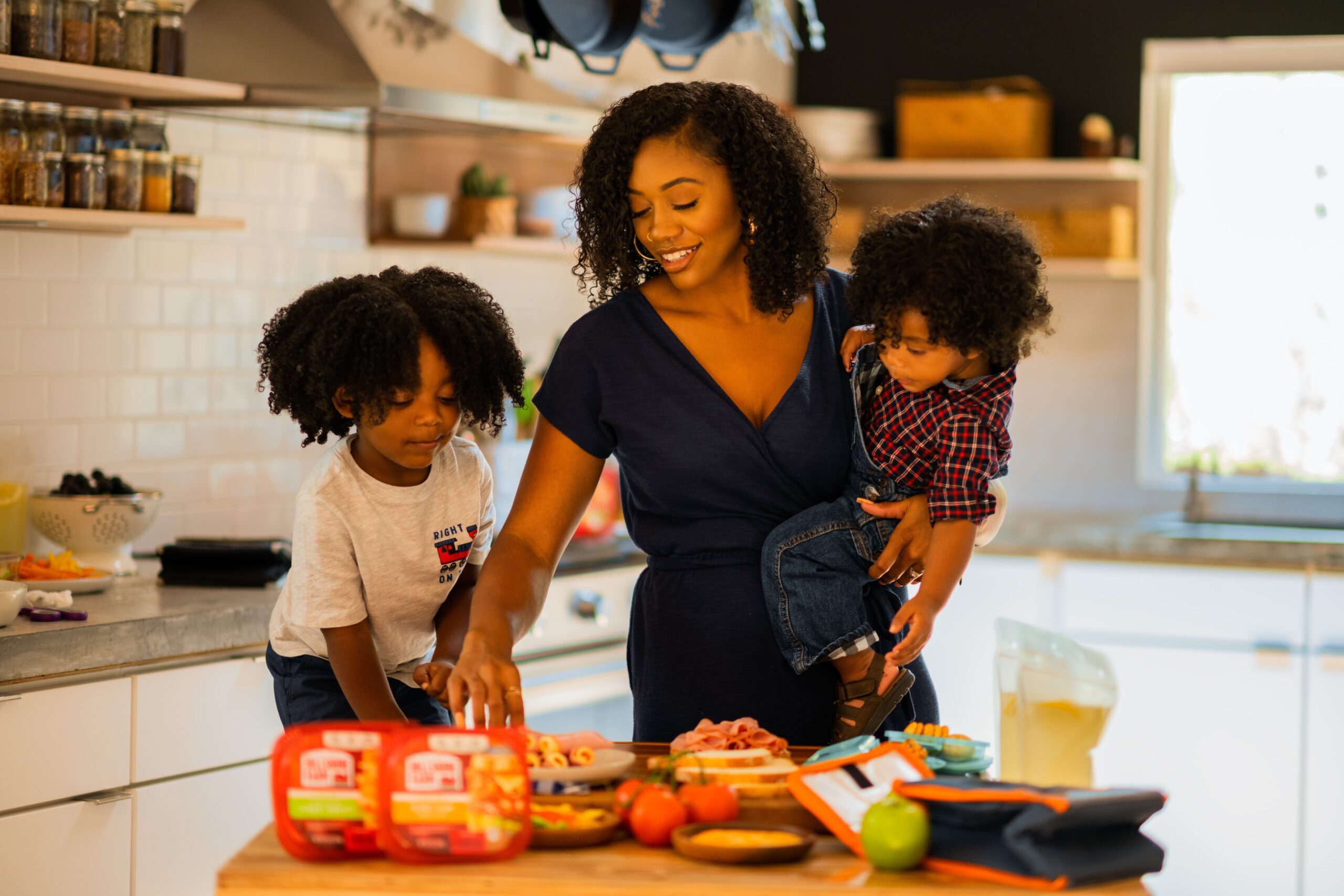 African-American Mom in the kitchen with her two children